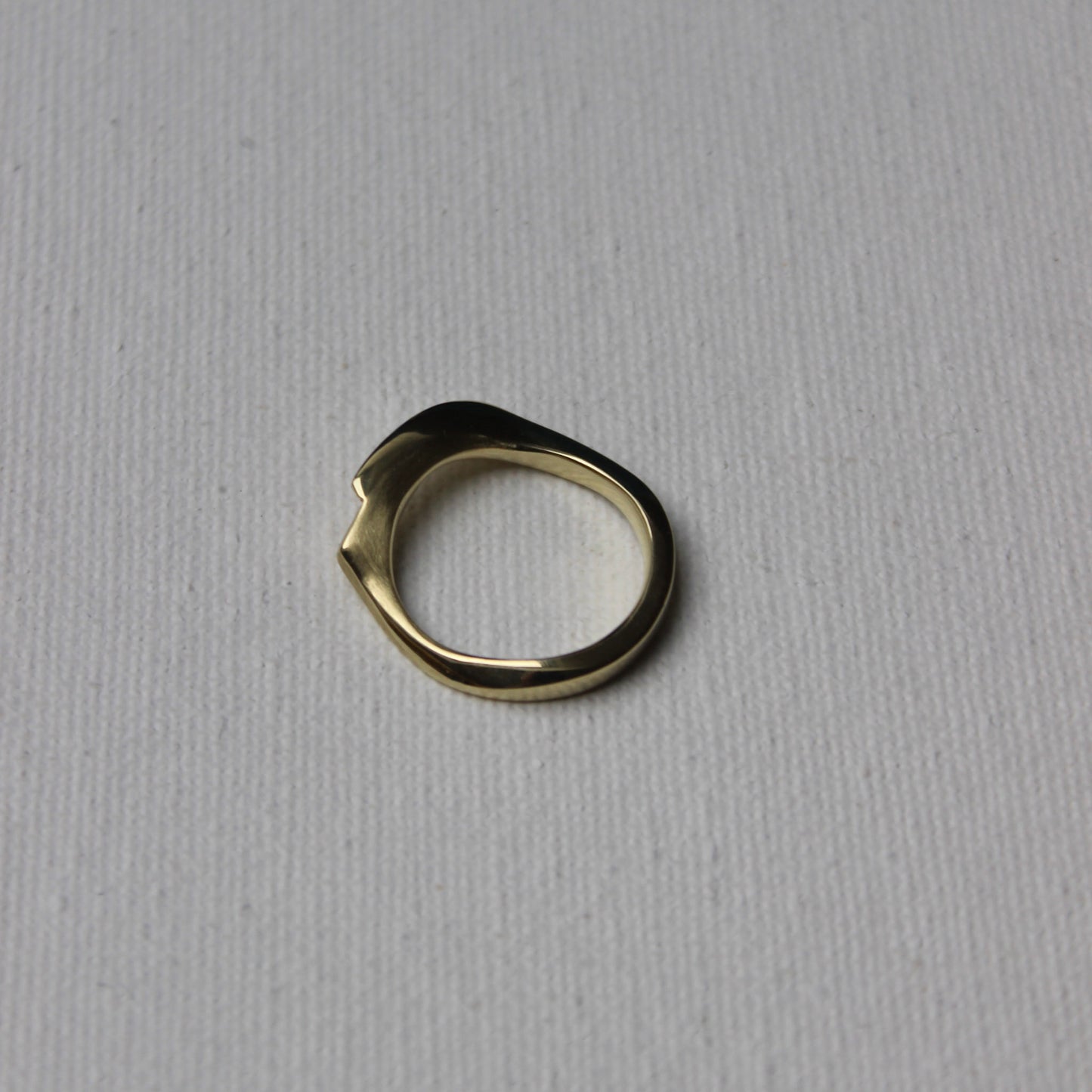 Gold ring on a gray background